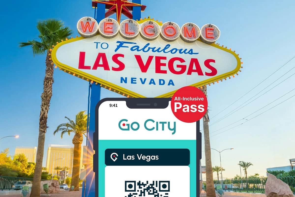 Las Vegas All-Inclusive Pass: 40+ Attractions including High Roller Las Vegas All-Inclusive Pass by Go City displayed on a smartphone with the Las Vegas welcome billboard in the background